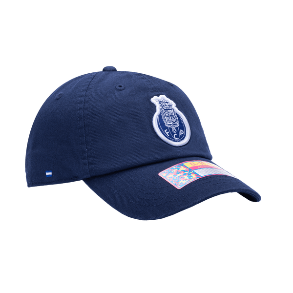 Side view of the FC Porto Bambo Classic hat with low unstructured crown, curved peak brim, and buckle closure, in blue.