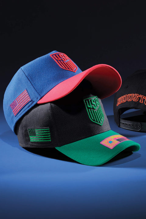 USA Soccers hats by Fan Ink on a blue backdrop