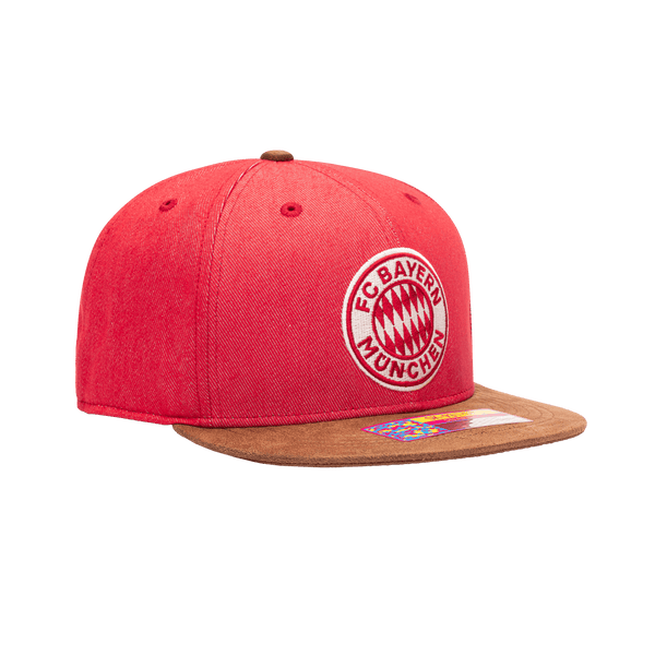 Side view of the Bayern Munich Orion Snapback with high structured crown, flat peak suede-like brim, and snapback closure, in Red/Brown.