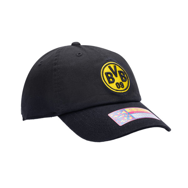 Side view of Borussia Dortmund Bambo Classic hat with low unstructured crown, curved peak brim, and buckle closure, in black.