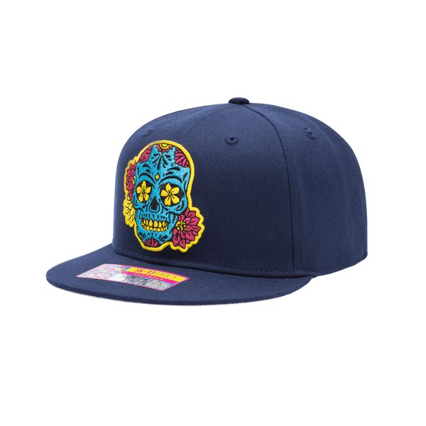 Club America Day of the Dead Snapback Hat with floral skull embroidered on the front, Club America embroidered on the side, "Dia de Muertos" embroidered on the back. The hat has a high crown, flat peak brim, and a snapback closure.