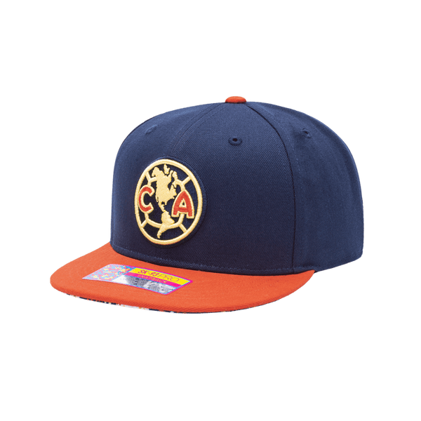 Club America Day of the Dead Snapback Hat with Club America logo embroidered on the front, floral skull embroidered on the side, "Dia de Muertos" embroidered on the back, and marigold and calavera print on the under peak. The hat has a high crown, flat peak brim, and a snapback closure.