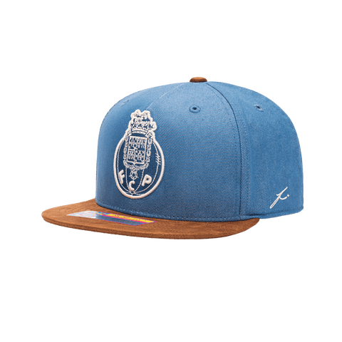 Side view of the FC Porto Orion Snapback with high structured crown, flat peak suede-like brim, and snapback closure, in Blue/Brown.