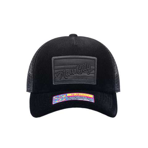 Front view of the Manchester City Signature Trucker with high crown, curved peak, and snapback closure on mesh back, in black.